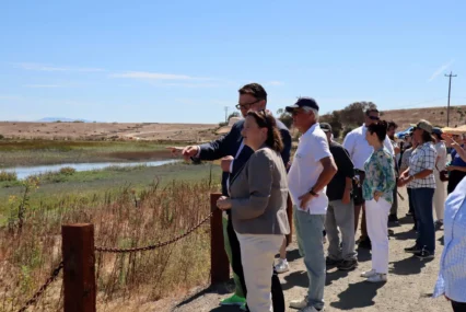 People looking out at a levee in Palo Alto, California