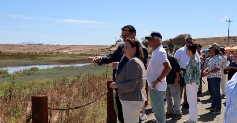 People looking out at a levee in Palo Alto, California