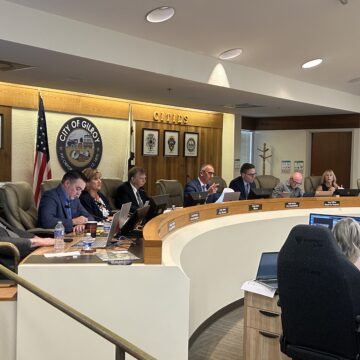 Gilroy Council approves moratorium on new data centers A row of people sitting behind a dais at a government meeting in Gilroy, California