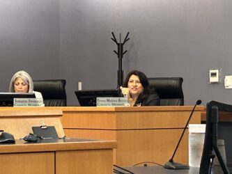 Morgan Hill Censure A woman sitting behind a dais at a government meeting in Morgan Hill, California