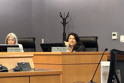 A woman sitting behind a dais at a government meeting in Morgan Hill, California