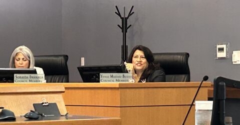 A woman sitting behind a dais at a government meeting in Morgan Hill, California