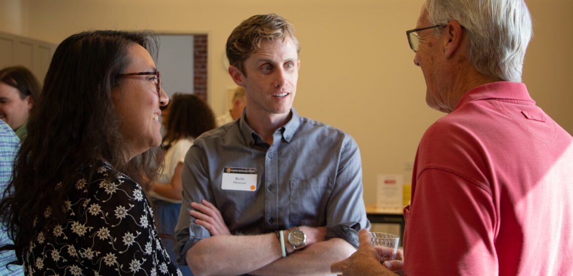 Three people talking at an open house in San Jose, California