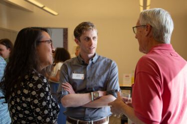 Open house Three people talking at an open house in San Jose, California