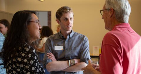 Three people talking at an open house in San Jose, California