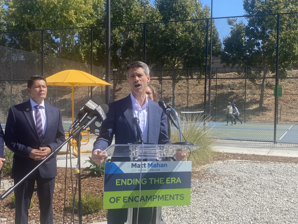 A man speaking at a podium outside in San Jose, California