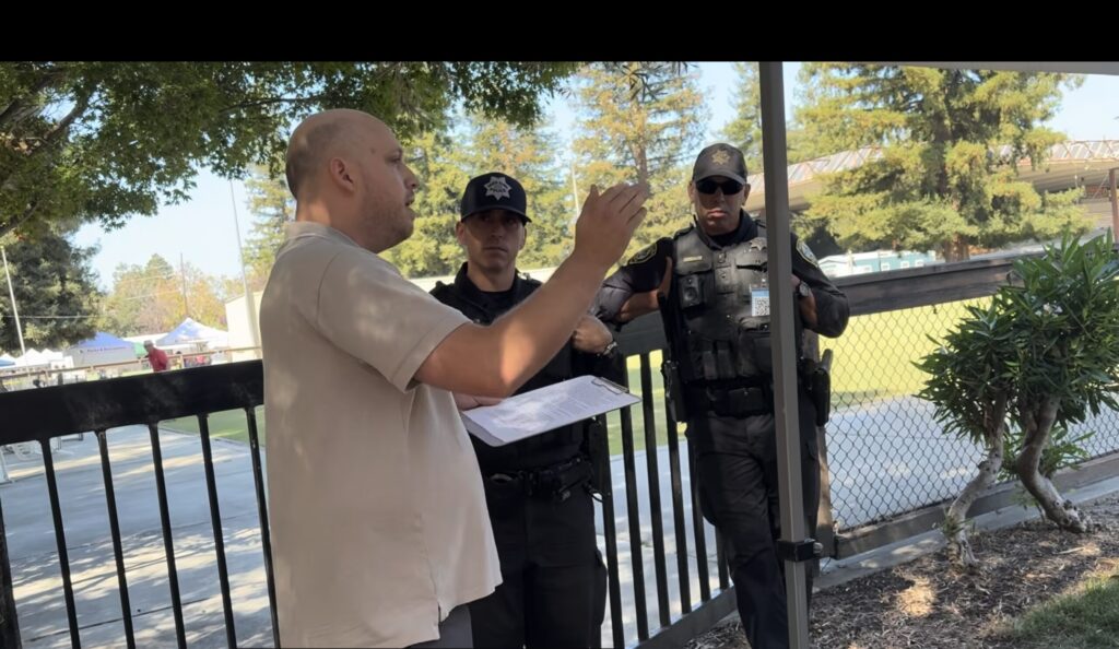 A man speaking with police outside in Santa Clara, California