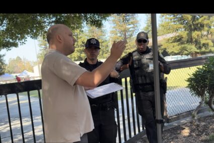 A man speaking with police outside in Santa Clara, California