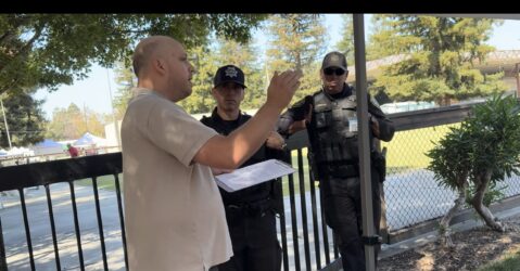 A man speaking with police outside in Santa Clara, California