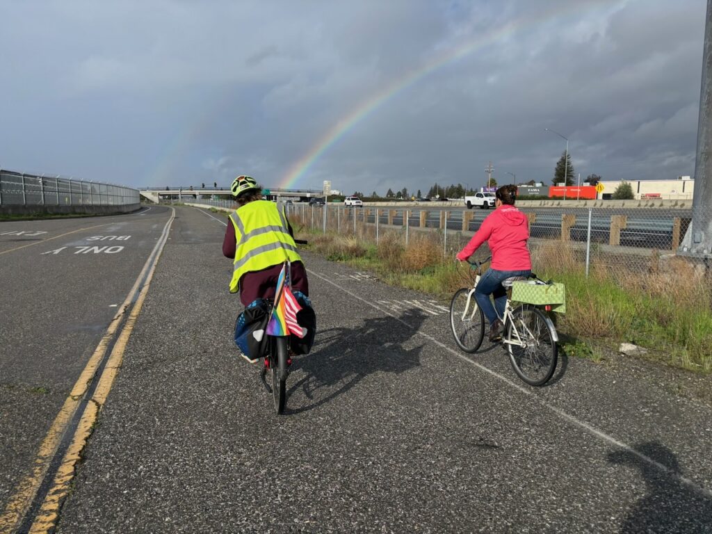 Two people riding bikes on a path in San Jose, California