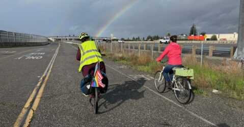 Two people riding bikes on a path in San Jose, California