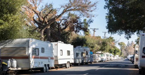 RVs lined up on a city street