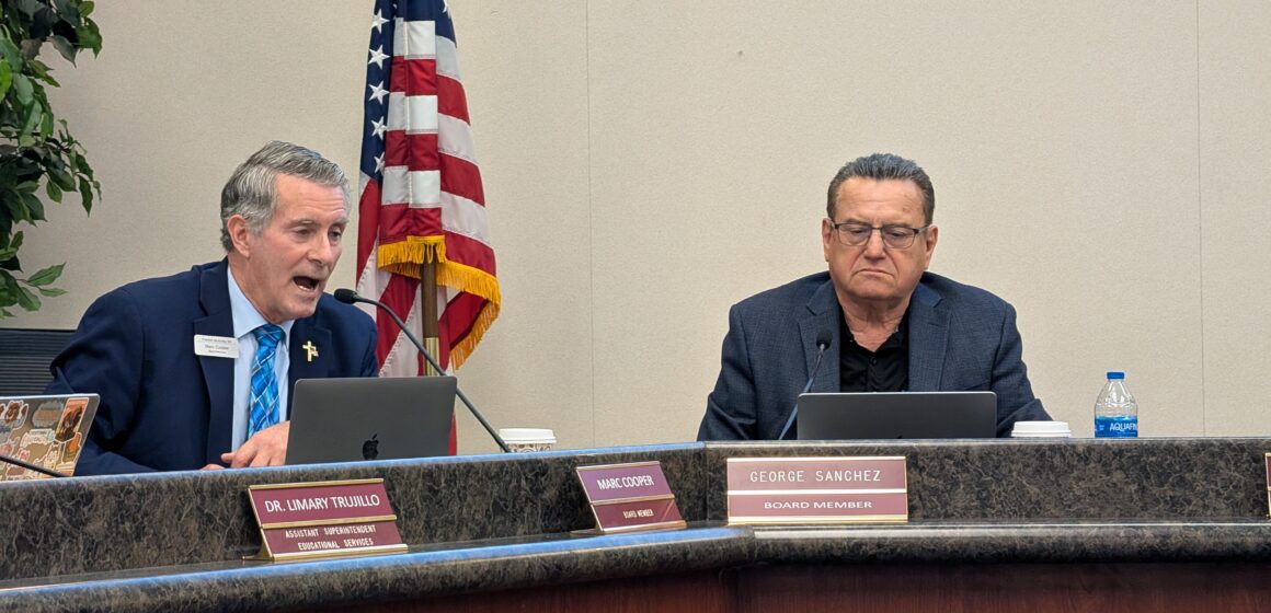 Two men sitting at a dais at a school board meeting in San Jose, California