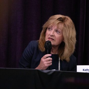 Santa Clara mayor election forum 2026 A woman holding a microphone at an election forum in Santa Clara, California