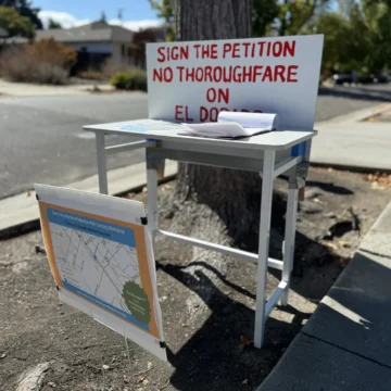 Palo Alto El Dorado bike tunnel petition Embarcadero A station for people to fill out a petition opposing plans for a bike tunnel in Palo Alto, California
