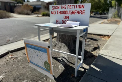 A station for people to fill out a petition opposing plans for a bike tunnel in Palo Alto, California