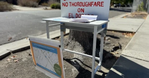 A station for people to fill out a petition opposing plans for a bike tunnel in Palo Alto, California