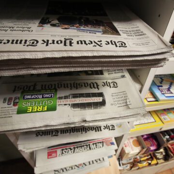 AP Poll Trust in Media A stack of newspapers in a media rack