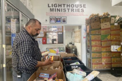 A man looking at produce at a food pantry in San Jose, California