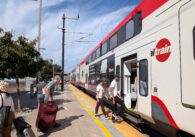 People boarding a train at a station in Sunnyvale, California
