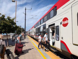 Caltrain at Sunnyvale station People boarding a train at a station in Sunnyvale, California
