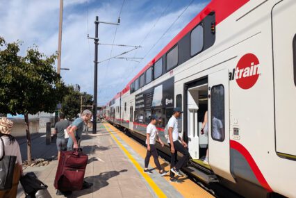 People boarding a train at a station in Sunnyvale, California