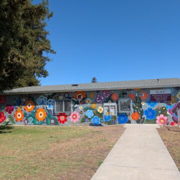 The exterior of a building with a mural in San Jose, California
