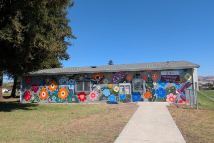 The exterior of a building with a mural in San Jose, California
