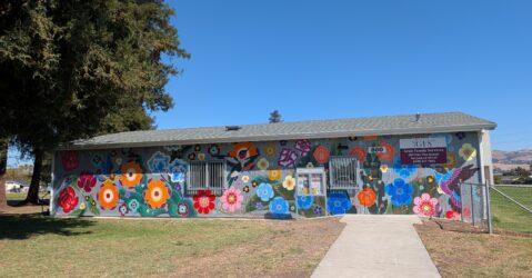 The exterior of a building with a mural in San Jose, California
