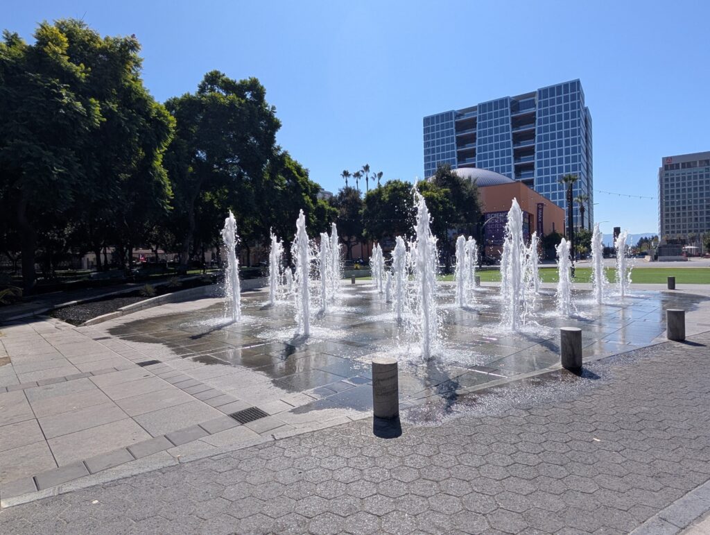 Water fountains spraying water in the air at a plaza in San Jose, California
