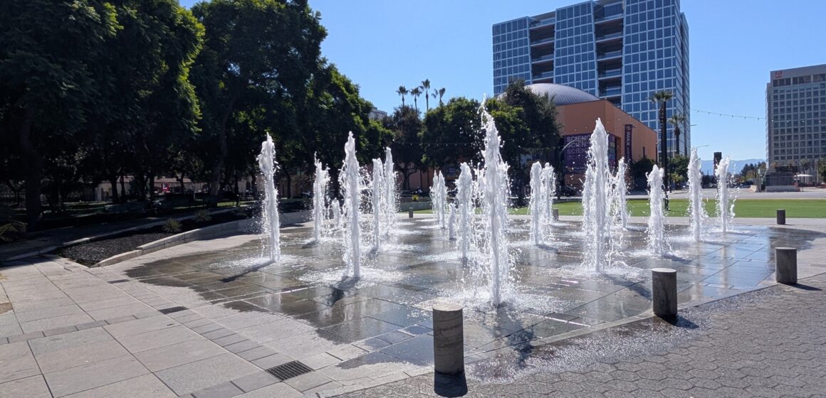 Water fountains spraying water in the air at a plaza in San Jose, California