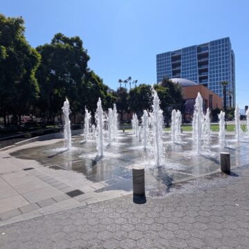 Water fountains spraying water in the air at a plaza in San Jose, California