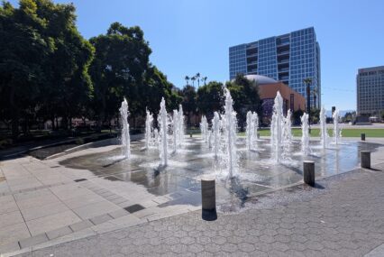 Water fountains spraying water in the air at a plaza in San Jose, California