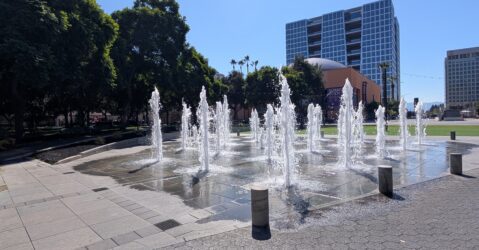 Water fountains spraying water in the air at a plaza in San Jose, California