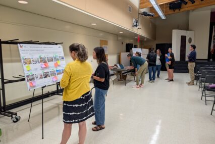 People looking at conceptual plans for a school renovation in San Jose, California