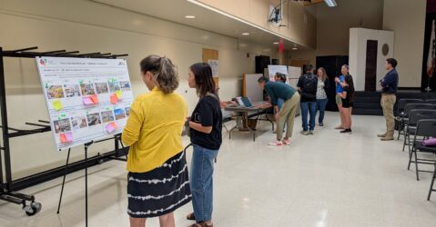 People looking at conceptual plans for a school renovation in San Jose, California