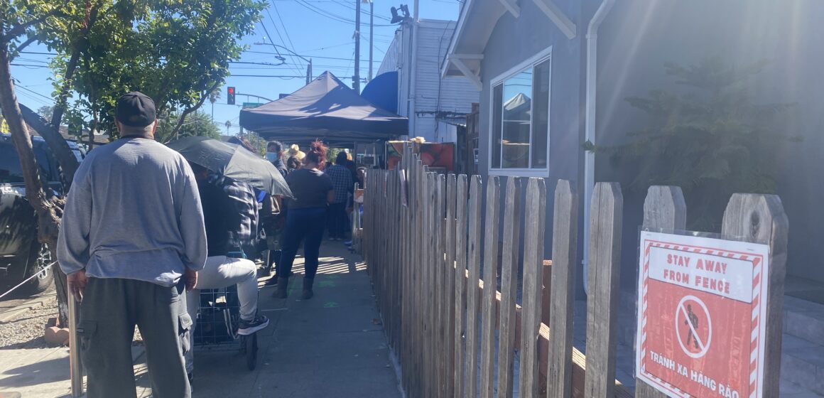 Lighthouse Food Pantry People waiting in line at a food pantry in San Jose, California