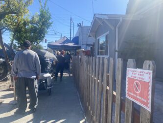 Lighthouse Food Pantry People waiting in line at a food pantry in San Jose, California