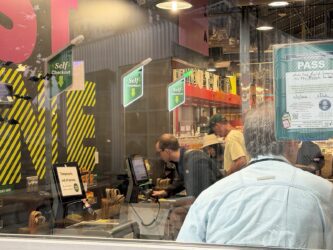 Self-checkout aisles Shoppers scan goods in a self-checkout line.