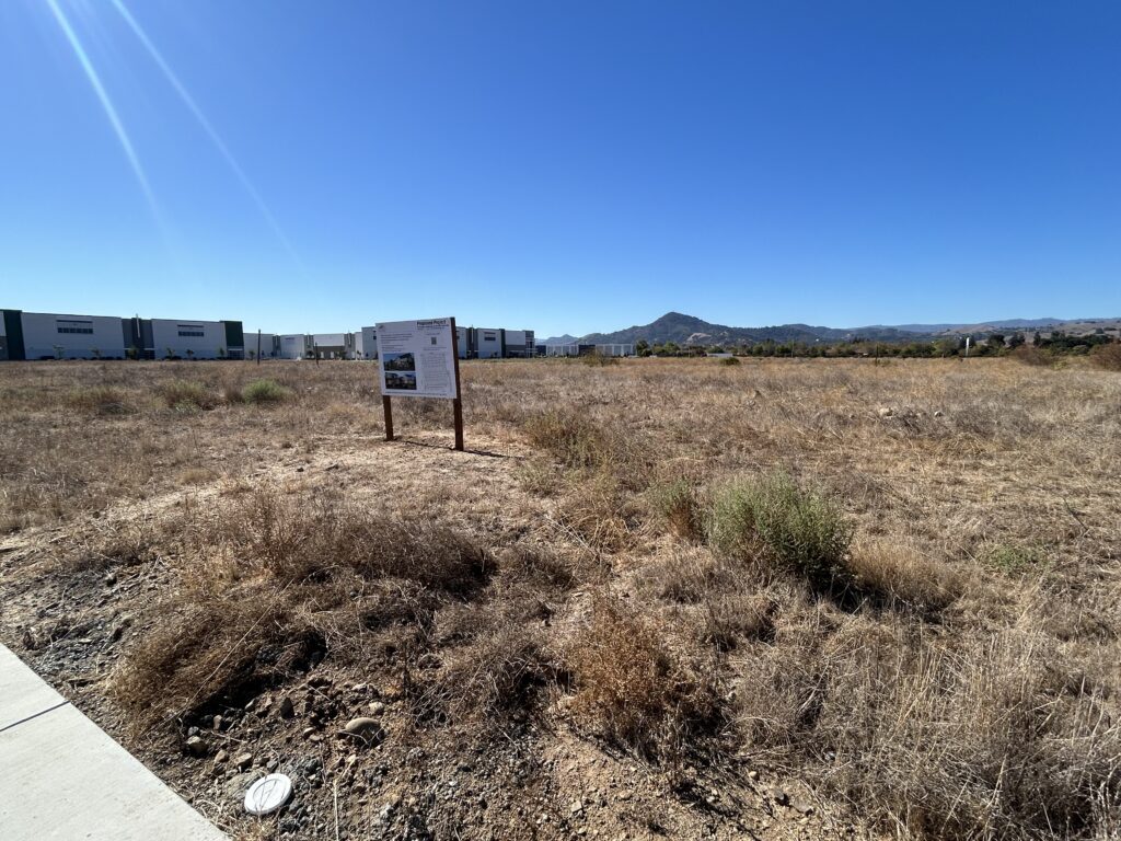 A development sign on a piece of land in Morgan Hill, California