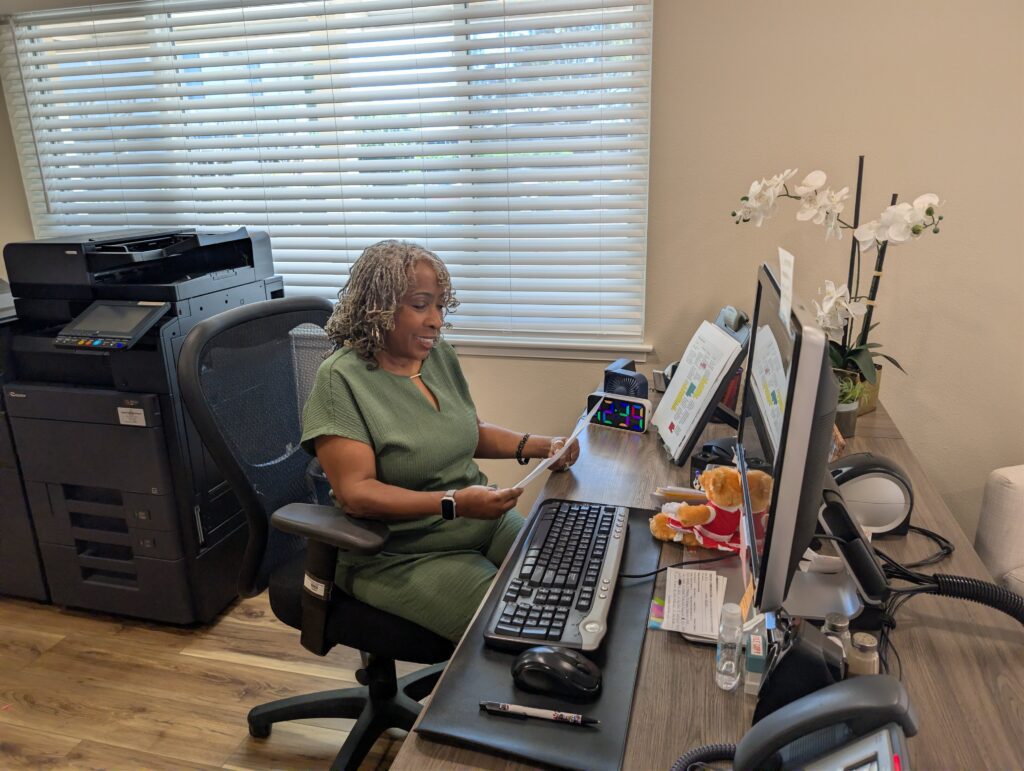 A woman sitting at a desk