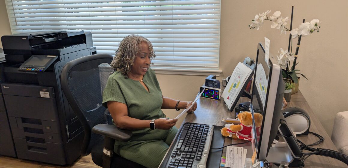 A woman sitting at a desk