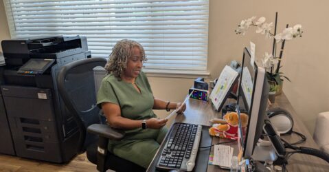A woman sitting at a desk