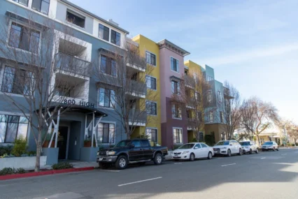 Cars parked in front of multistory housing building in Palo Alto, California