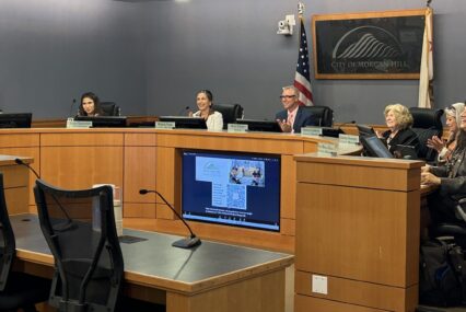 A group of people sitting at a government meeting in Morgan Hill, California