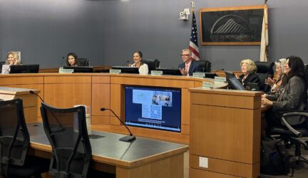 A group of people sitting at a government meeting in Morgan Hill, California