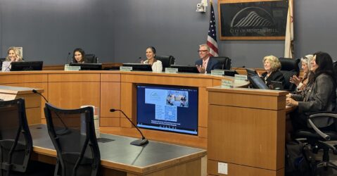 A group of people sitting at a government meeting in Morgan Hill, California