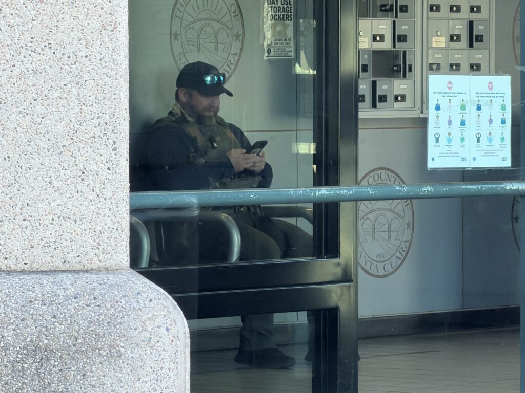 A federal agent sitting in the lobby of a jail in Santa Clara County, California