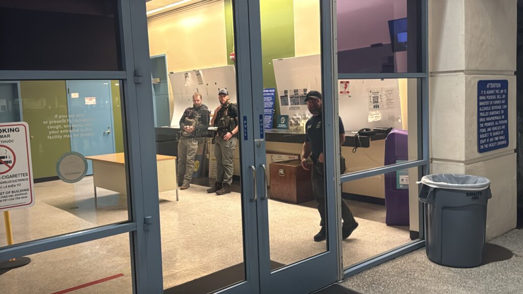 Federal immigration agents standing in the lobby of a jail in Santa Clara County, California
