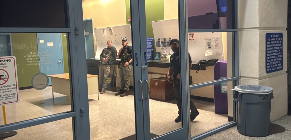 Federal immigration agents standing in the lobby of a jail in Santa Clara County, California